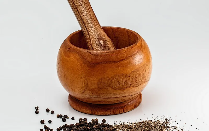 wooden mortar and pestle showing the tight, closed grain typical of acacia and other kitchen hardwoods wooden mortar and pestle showing the tight, closed grain typical of acacia and other kitchen hardwoods