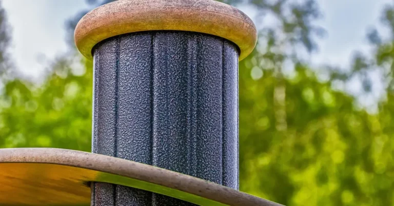 Wood rail mounted to a round metal pole using a bracket connection