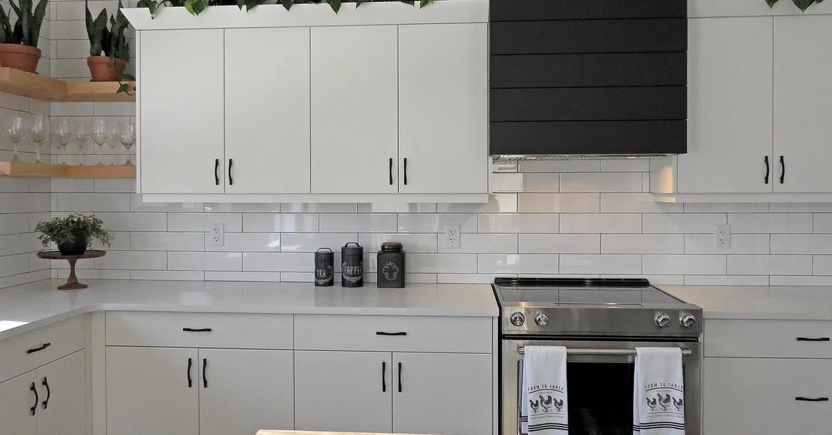 Painted gray kitchen cabinets with a clear protective topcoat in a farmhouse-style kitchen