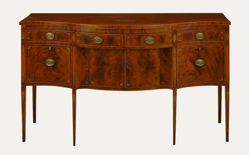 Antique mahogany sideboard with inlaid drawer fronts and brass pulls