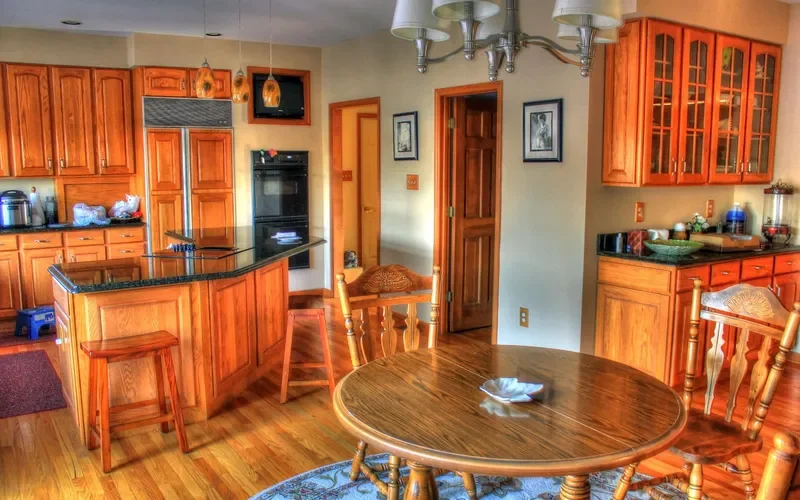 Stained oak kitchen cabinets with glass-front upper doors Stained oak kitchen cabinets with glass-front upper doors