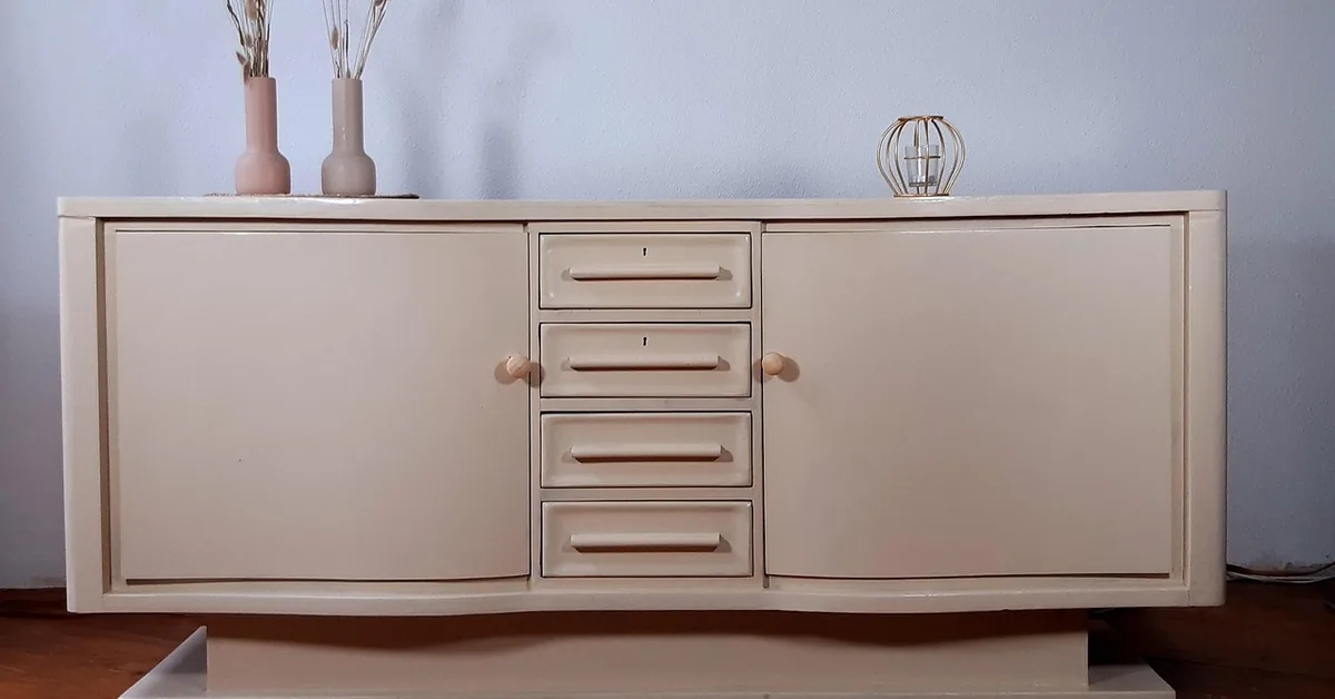 Cream painted sideboard with four center drawers and two doors
