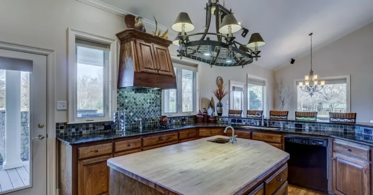 Kitchen with stained solid wood cabinet doors and a butcher block island