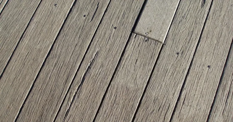 Weathered deck boards with a worn gray surface