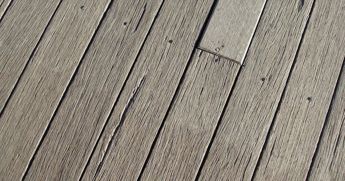 Weathered deck boards with a worn gray surface