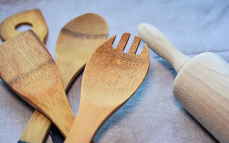 wooden spoons and a spatula showing a smooth, tight grain surface wooden spoons and a spatula showing a smooth, tight grain surface