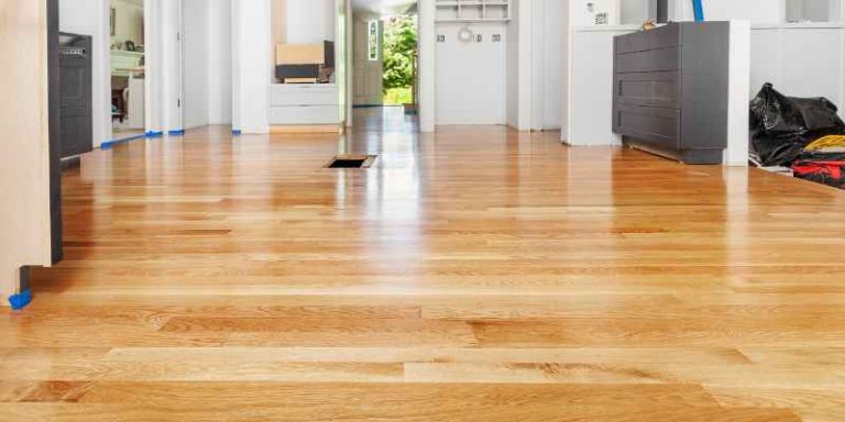Freshly refinished engineered hardwood floor in a bright living room