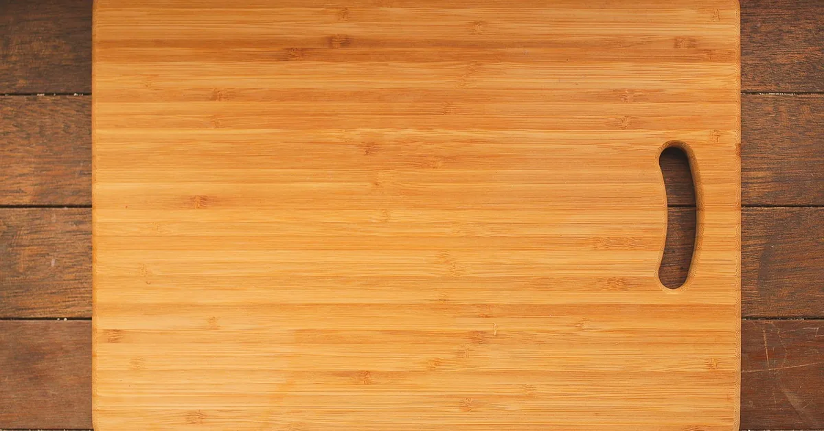 wooden cutting board on a kitchen counter, top view