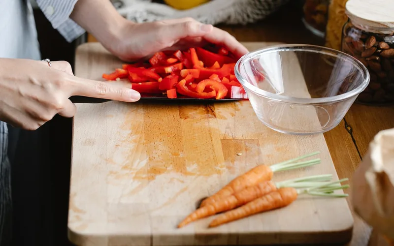 chopping vegetables on a hardwood cutting board
