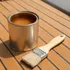 Tin of amber marine spar varnish with a natural bristle brush