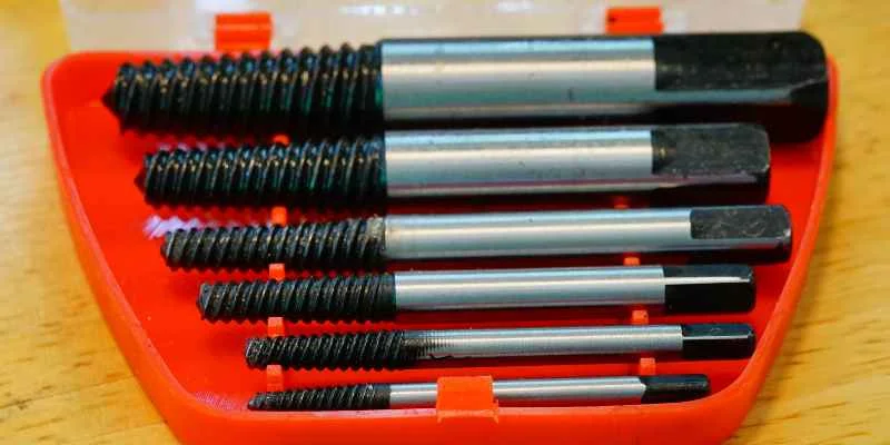 A screw extractor bit set for removing damaged or headless screws