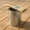 Can of clear exterior spar urethane wood sealer with a paintbrush