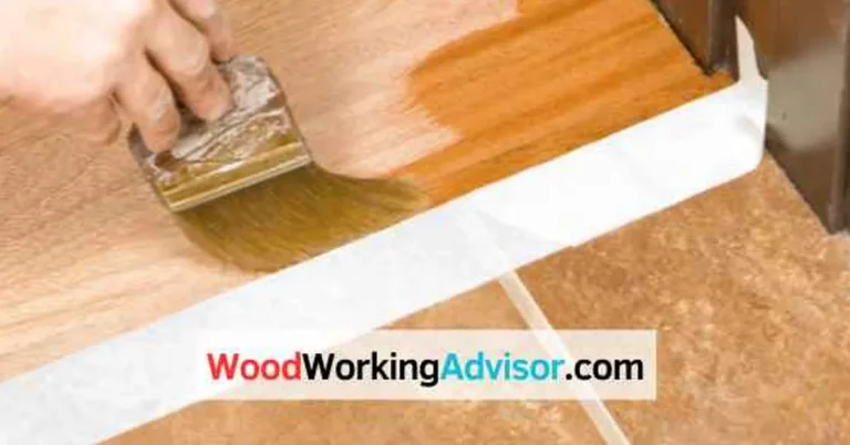 Applying wipe-on polyurethane with a brush along a wood floor edge