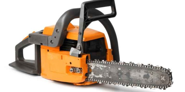 Arborist using a professional chainsaw for tree limbing
