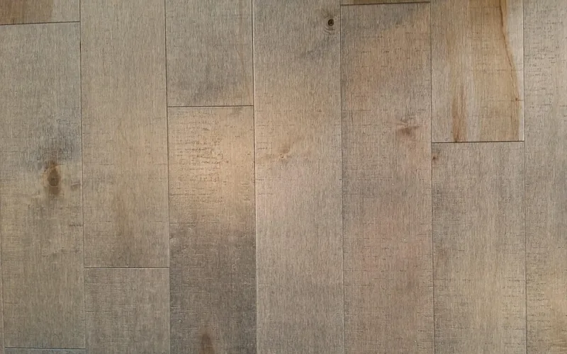 Light-toned ash wood flooring planks with straight grain and pale color