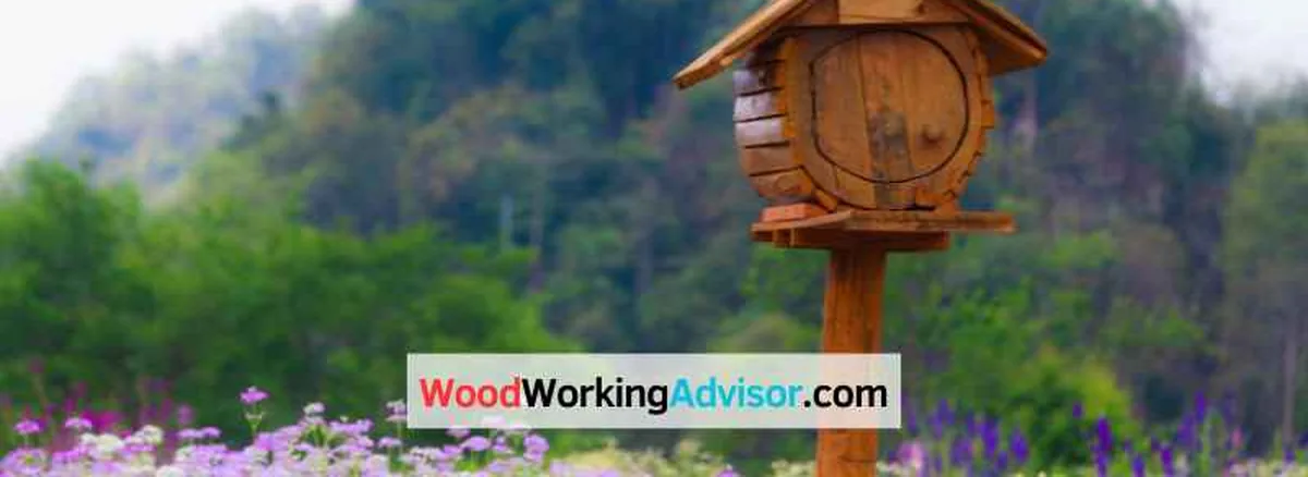 Cedar wood mailbox on a wooden post in a garden setting