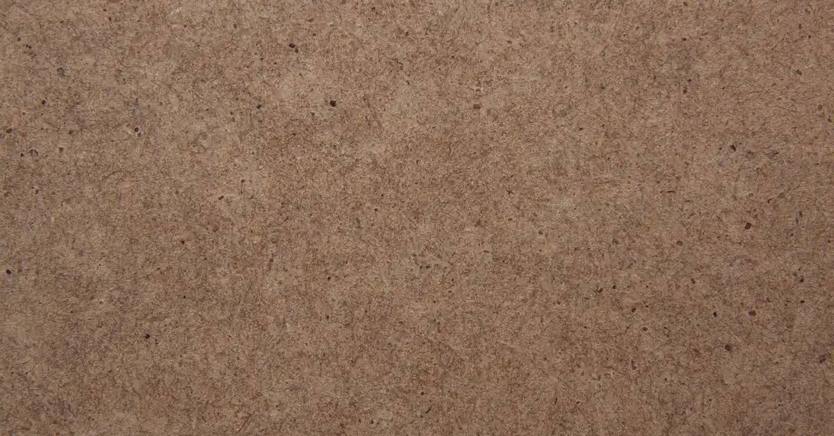 Close-up of a brown fiberboard panel surface