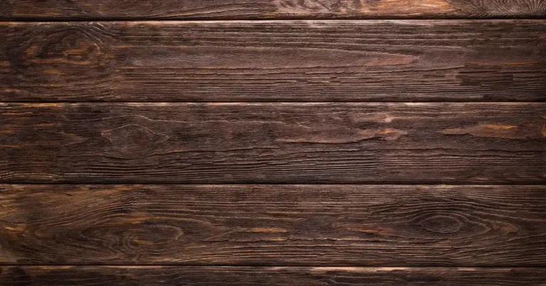 dark brown thermally modified wood grain close-up after heat treatment