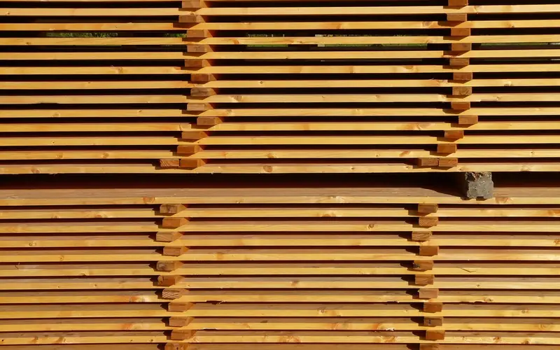 Sawn boards stacked with stickers between layers for air circulation Sawn boards stacked with stickers between layers for air circulation