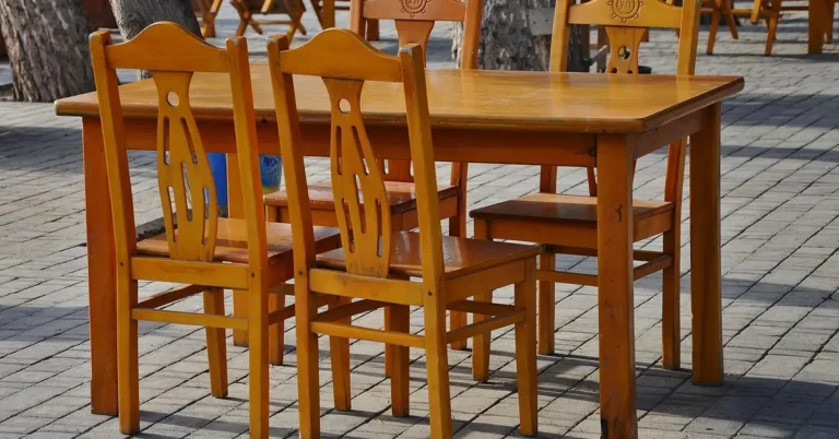 solid wood dining table and chair set finished in a warm honey-brown tone