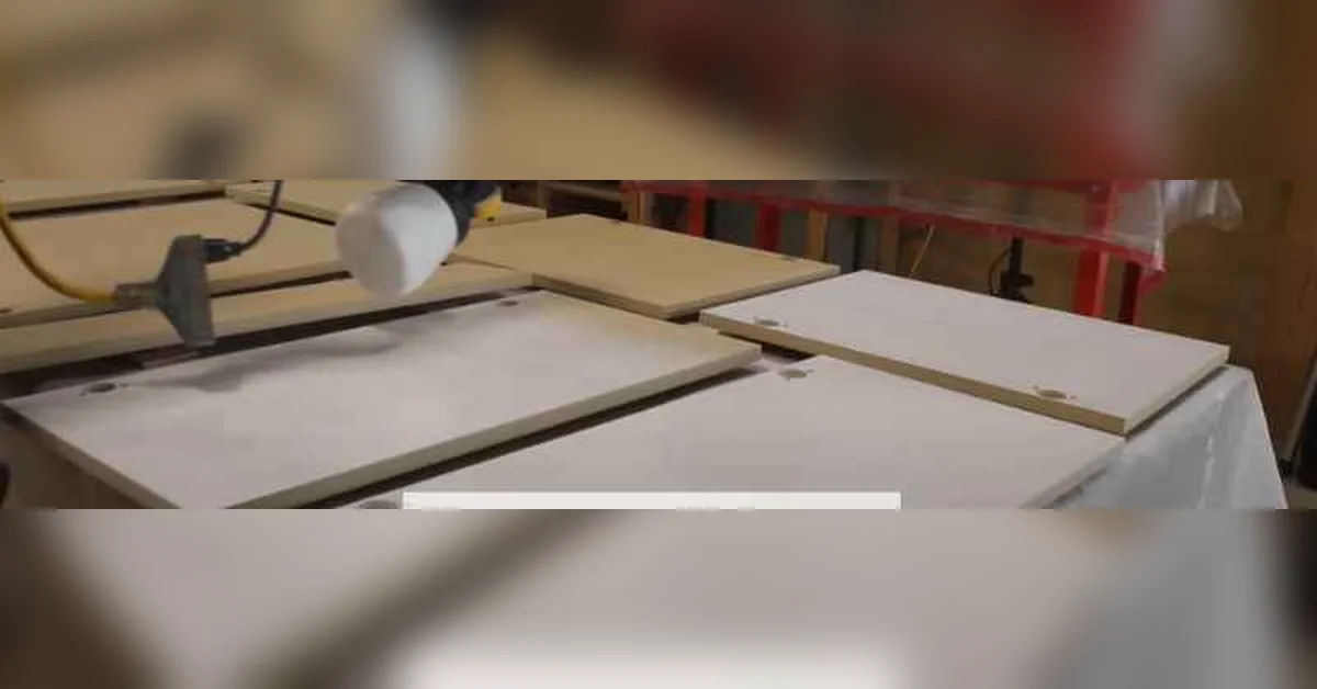 Priming MDF cabinet door panels before drying, showing 24 to 48 hour dry time