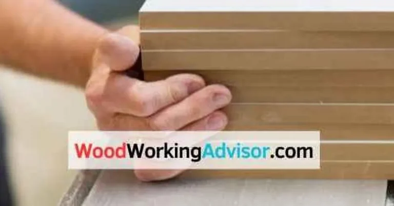 Stack of MDF boards being handled in a workshop, showing the material affected by heat and humidity