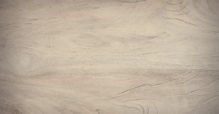 Close-up of pale poplar lumber grain showing straight fibers typical of the wood