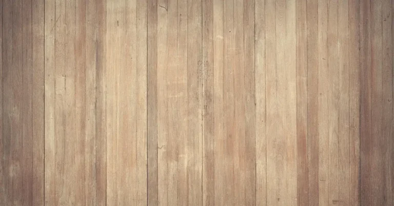 close-up of warm honey-brown hardwood grain, the tone family acacia wood pairs into