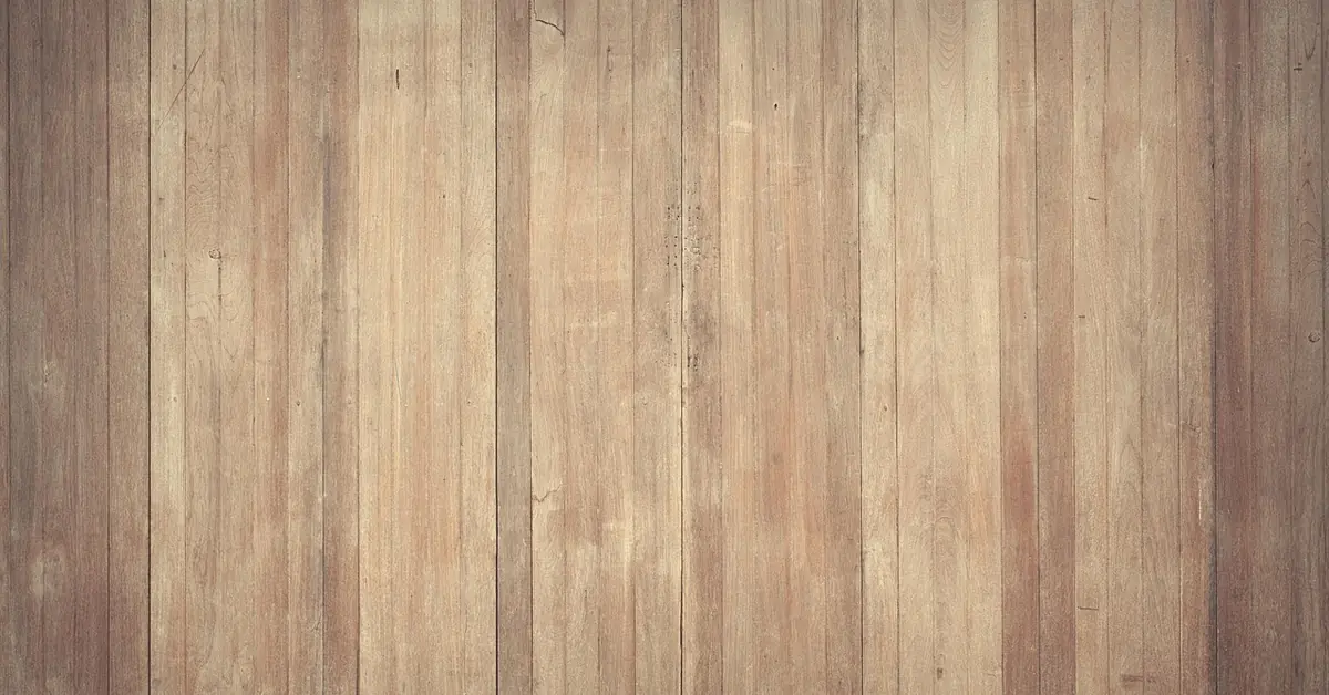 close-up of warm honey-brown hardwood grain, the tone family acacia wood pairs into
