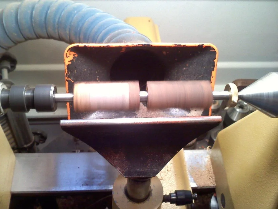Woodturning lathe in a home workshop, tool rest set up for spindle work Woodturning lathe in a home workshop, tool rest set up for spindle work