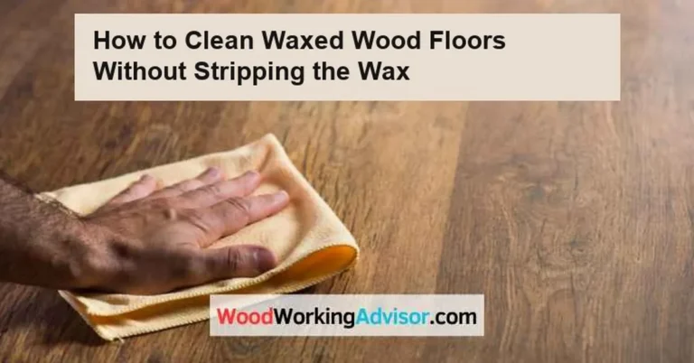 Hand wiping a waxed hardwood floor with a soft microfiber cloth