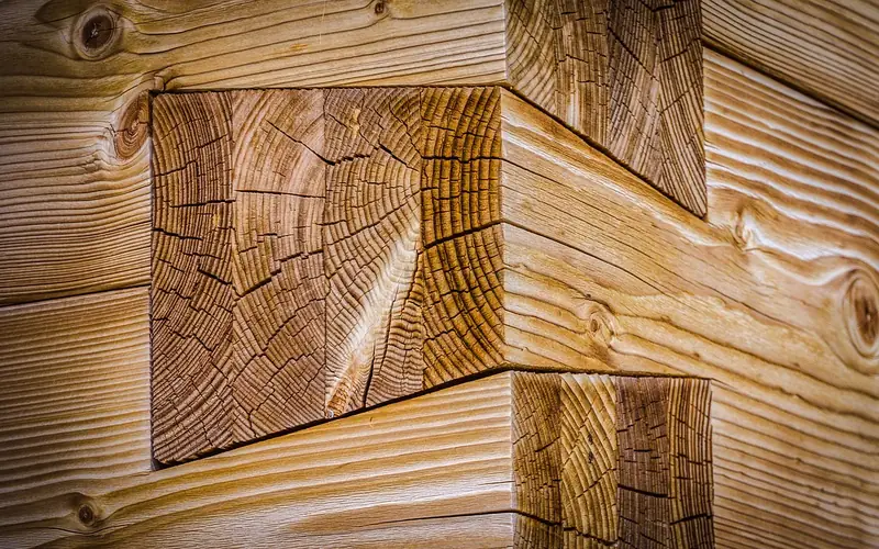 tight dovetail joint in solid wood showing a seamless glue line