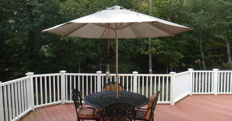 Wraparound composite deck with railing and outdoor furniture