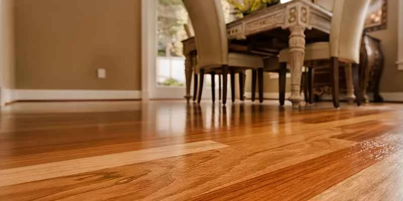 Dining room with rich-toned solid hardwood flooring Dining room with rich-toned solid hardwood flooring