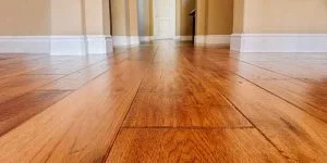 Hallway with wide-plank solid hardwood flooring Hallway with wide-plank solid hardwood flooring