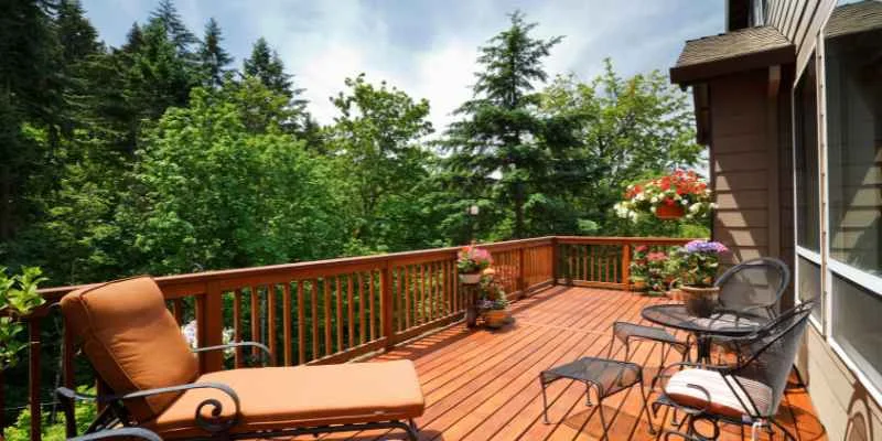 a newly installed wood deck showing labor and material cost factors