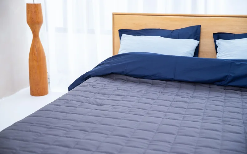 close-up of memory foam mattress and bedding showing quilted fabric surface