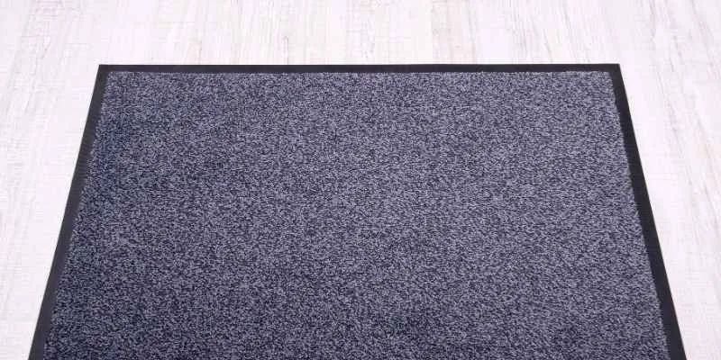 close-up of a non-slip rug backing on a hardwood floor