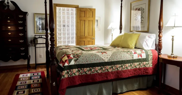 rug runner secured on hardwood floor beside a bed in a bedroom