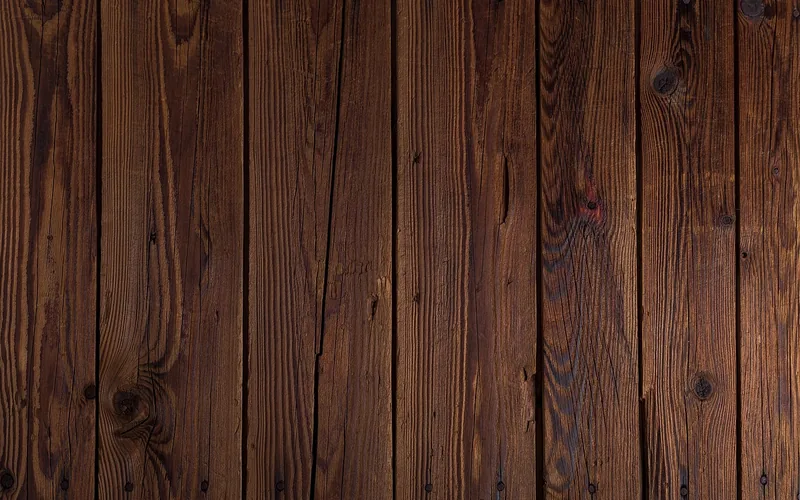 Close-up of vertical wood plank wall grain and knots showing natural texture Close-up of vertical wood plank wall grain and knots showing natural texture