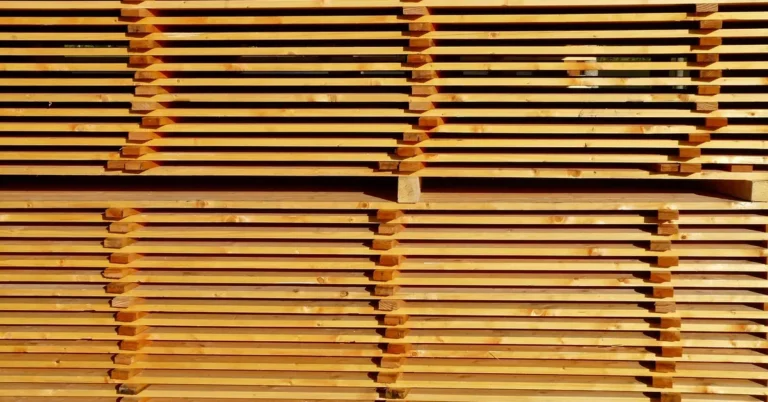stickered stack of sawn lumber boards at a lumber yard