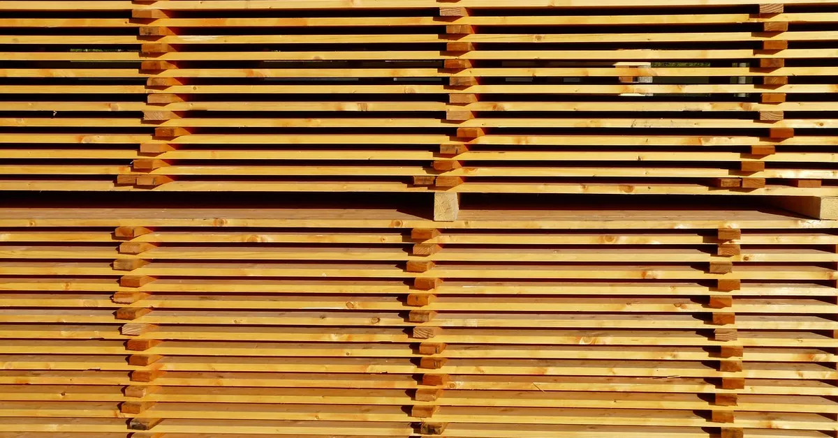 stickered stack of sawn lumber boards at a lumber yard