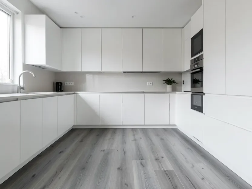 Cool gray-washed oak hardwood flooring in a modern white kitchen