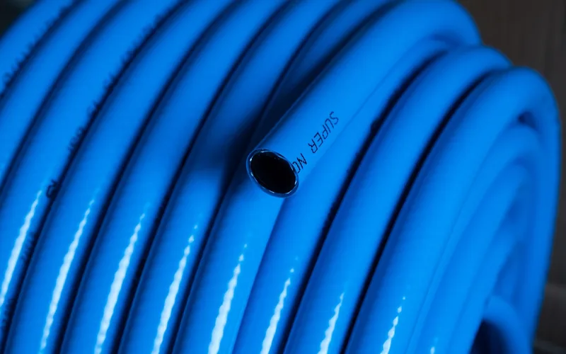 Coiled air compressor hose Coiled rubber air hose used to connect a shop compressor tank to pneumatic tools
