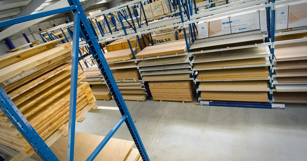 MDF and particleboard sheets stacked flat on warehouse storage racks