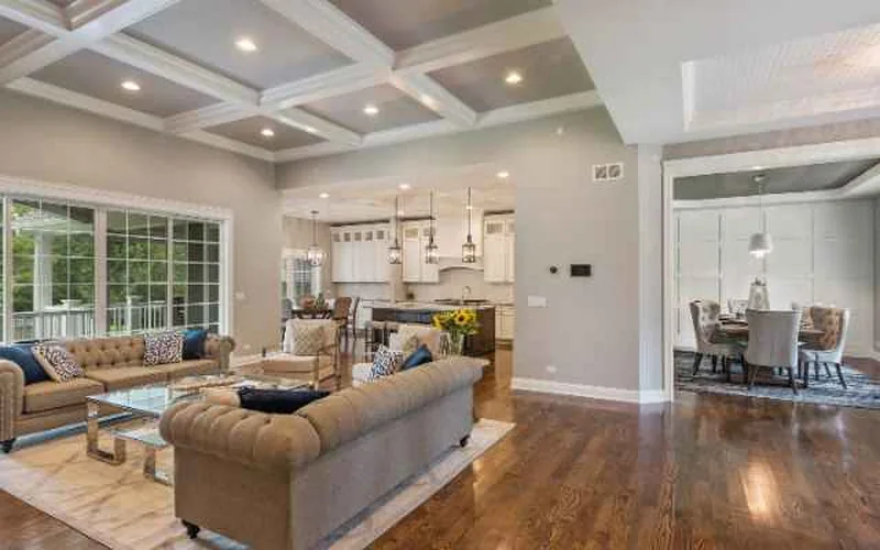 medium brown hardwood floor in an open living and dining room