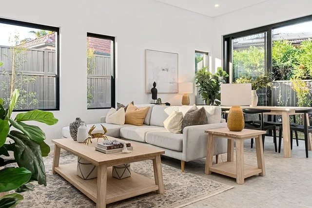 Modern living room with large sliding glass doors opening to a patio
