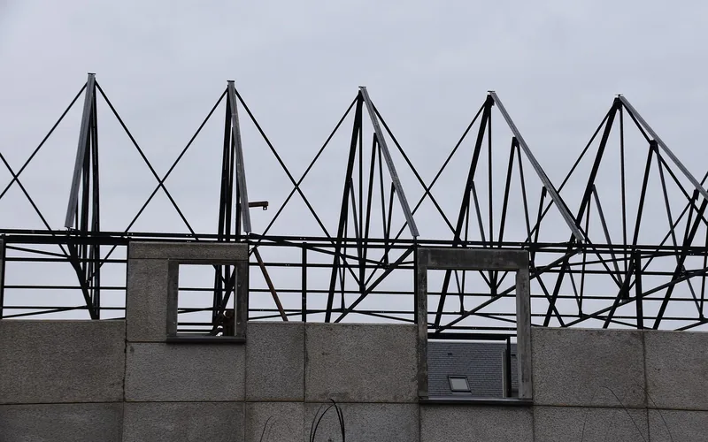 close-up of steel roof truss framing on a metal-framed building