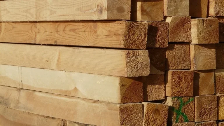 Stack of sawn softwood timber battens in sunlight