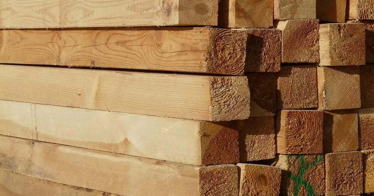 Stacked sawn lumber boards drying in a storage yard
